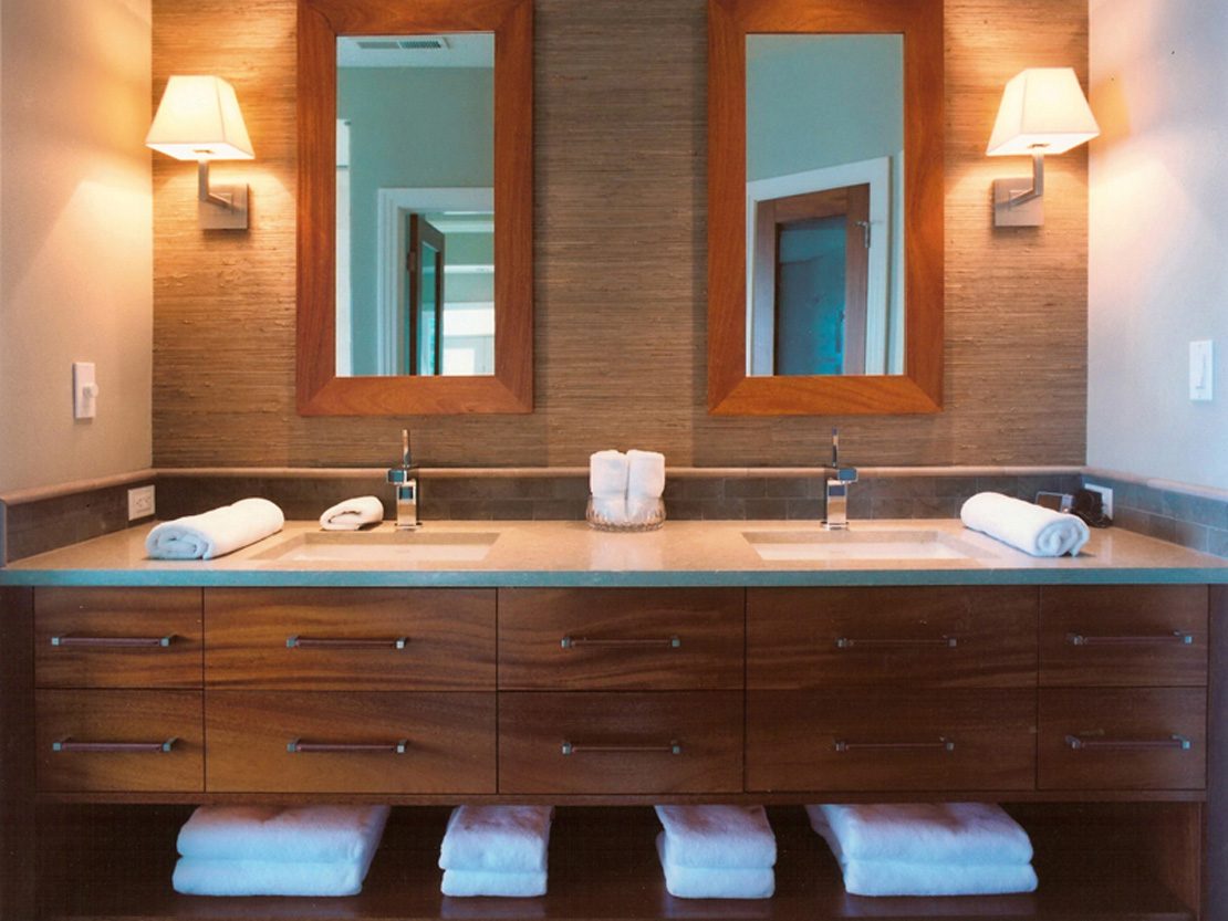 Teak vanity bathroom with dual sinks by CM&D